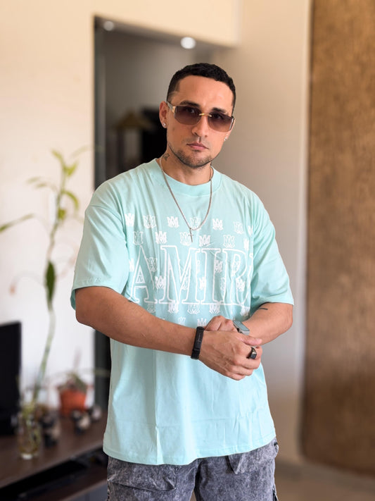 Polera amiri oversize verde agua detalles varios pequeños