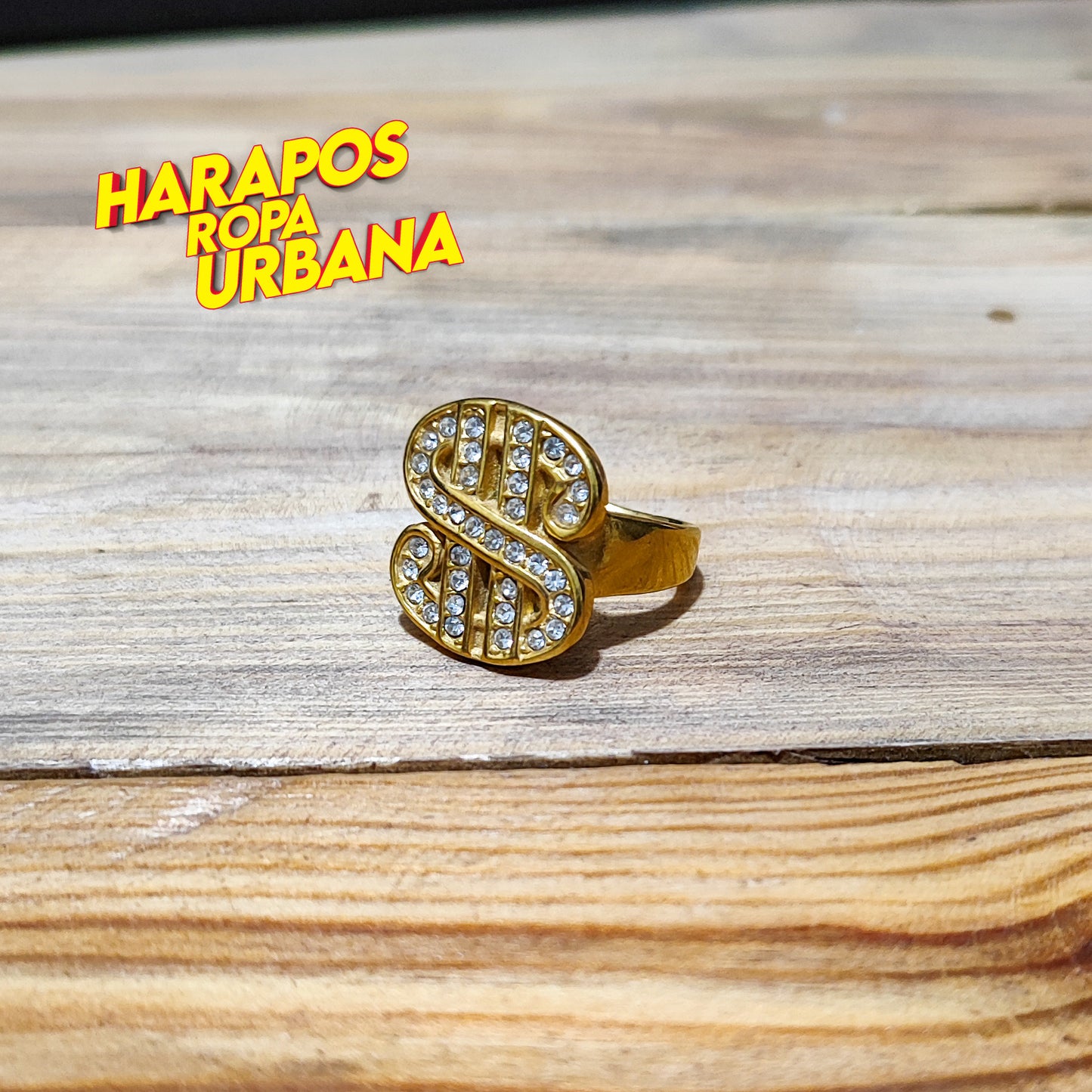 Anillo de acero dorado signo dolar diamantes