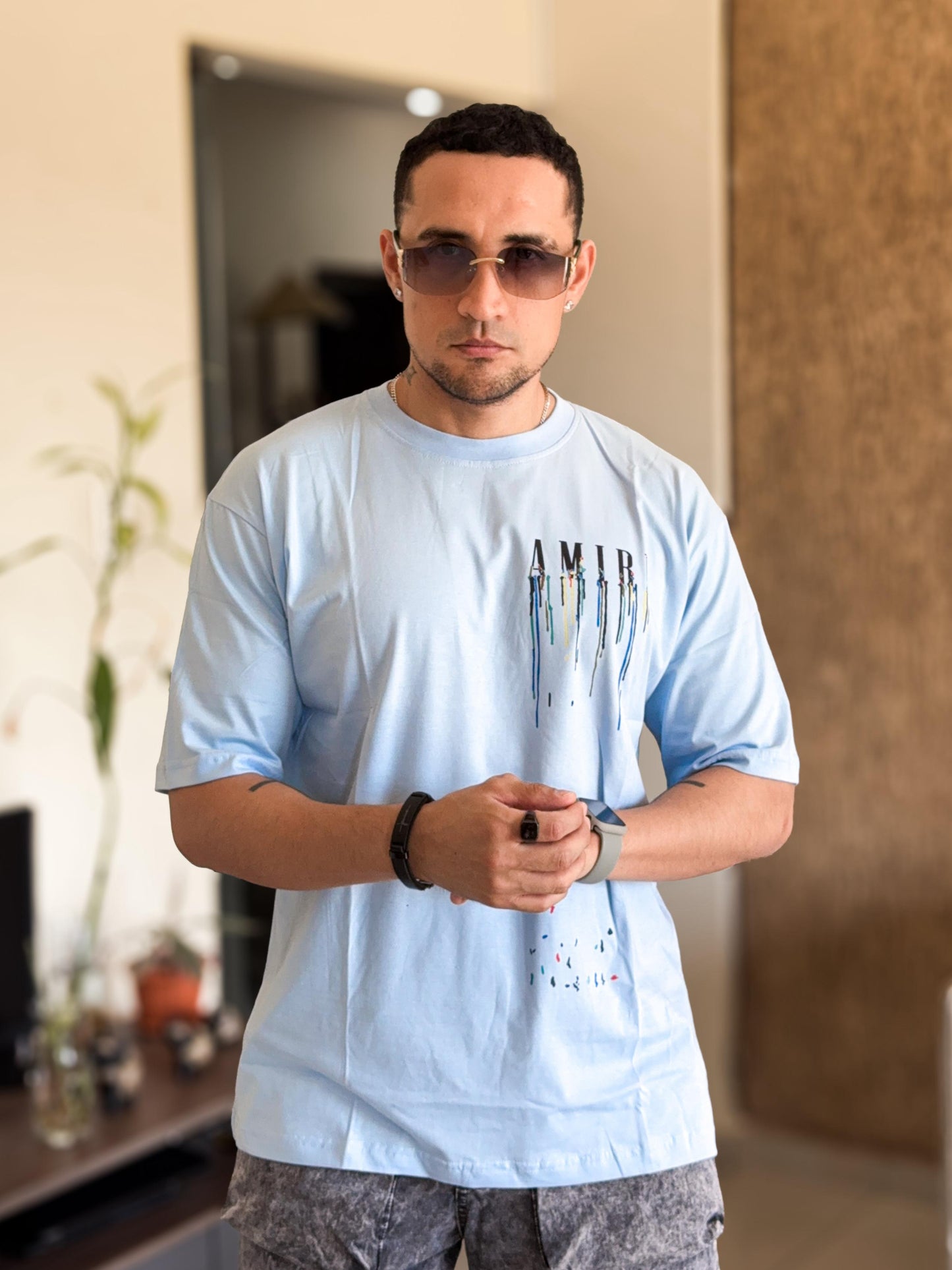 Polera amiri celeste letras derretidas