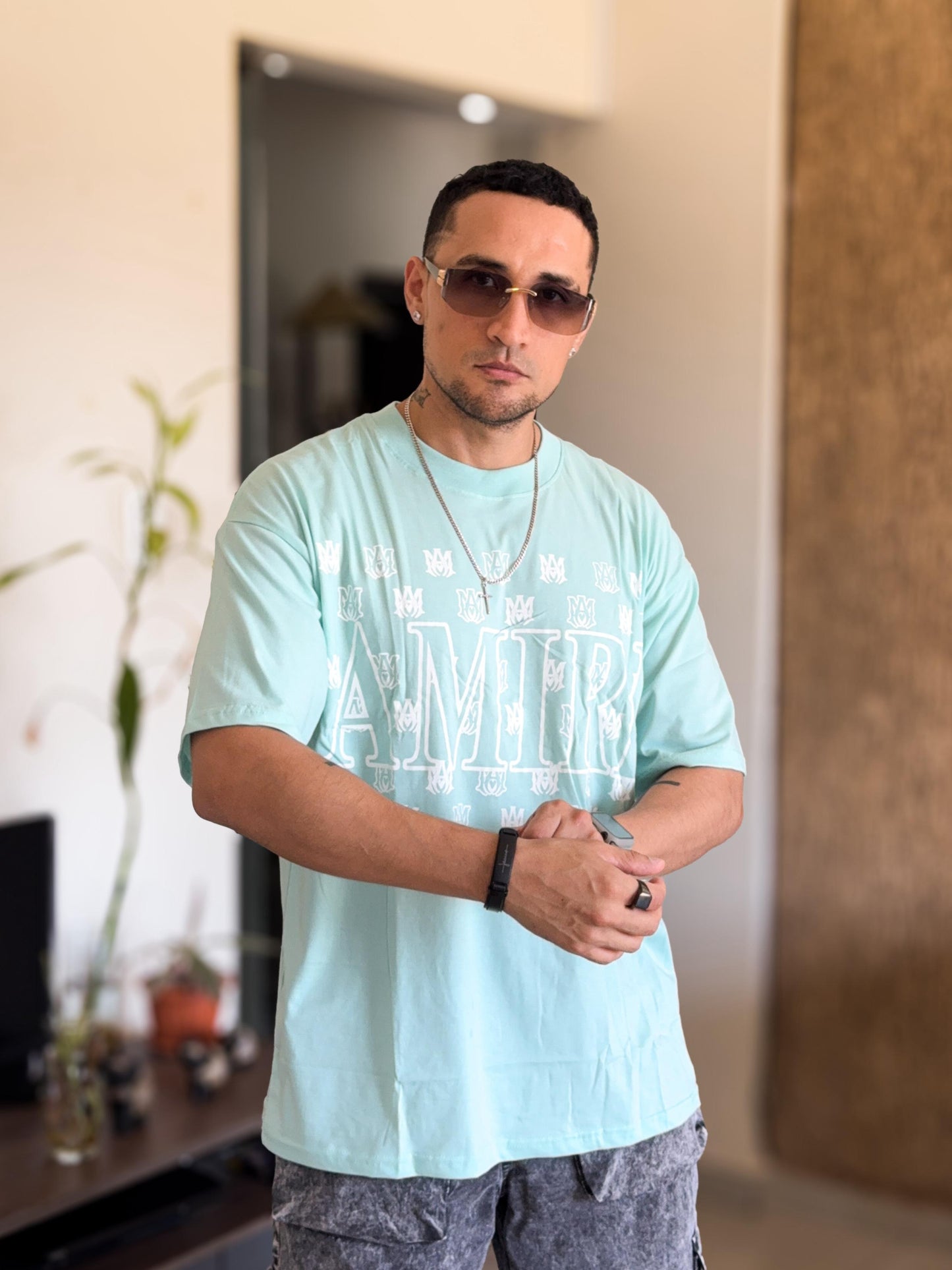 Polera amiri oversize verde agua detalles varios pequeños